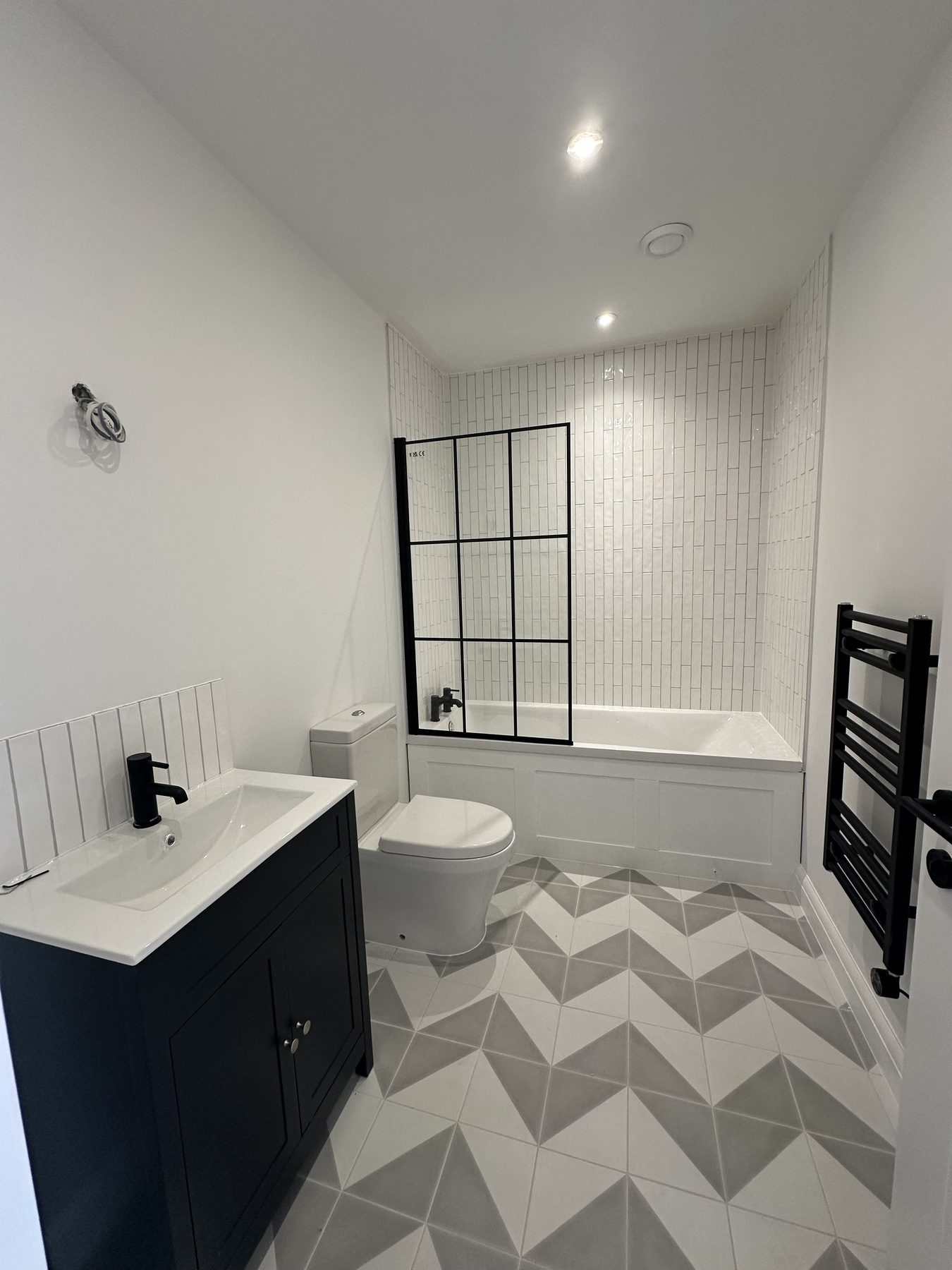 Bathroom with patterned floor tiles
