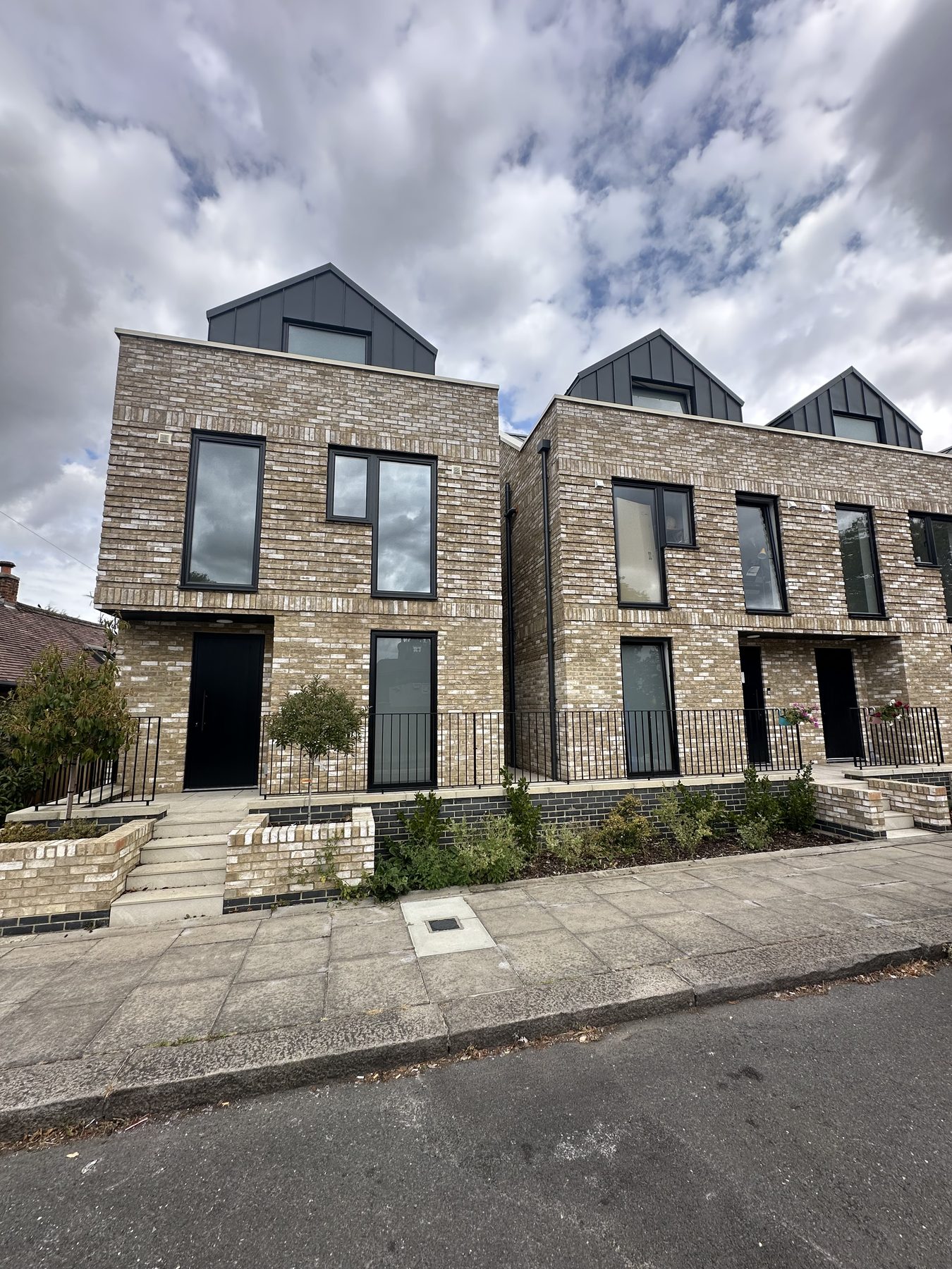 Pair of new townhouses with landscaped frontages